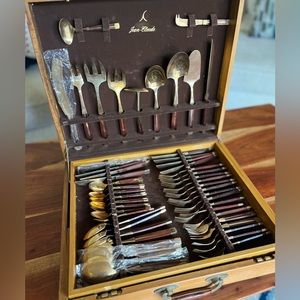 JEAN-CLAUDE MCM Gold Brass & Rosewood Flatware Collection - 91 pieces.